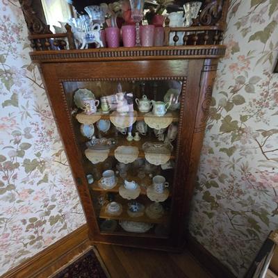 Carved antique corner cabinet