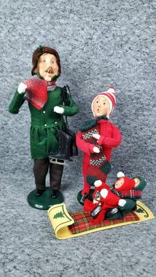 Byer s choice carolers man with skates, child, children sledding