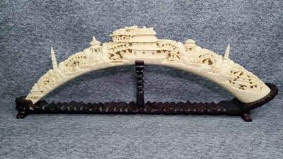 Carved asian resin tusk on stand