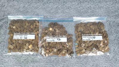 Three 5 lb bags of one cent pieces