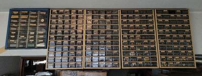 HANGING CABINET FILLED WITH TOOL PARTS