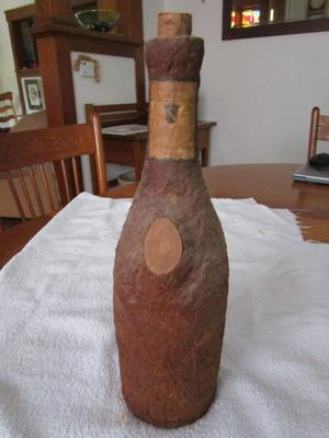 Sale Photo Thumbnail #86: Liquor bottle molded with cork.