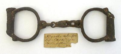 Sale Photo Thumbnail #58: Manacles from Fort Sumter with early handwritten note