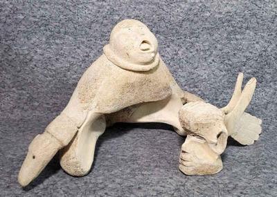 Alaskan hand carved whale bone art sculptures