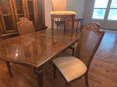 Midcentury dining room set with  cane back chairs. 