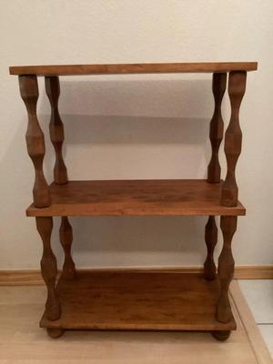 Three tiered wooden shelf with turned legs