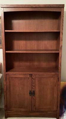 Wooden book shelf with bottom storage