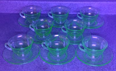 Sale Photo Thumbnail #62: Setting for 8 Uranium Glass Teacup & Saucer Set