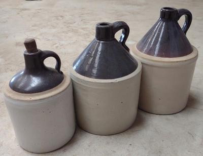 Sale Photo Thumbnail #618: 3 Stoneware Moonshine Jugs