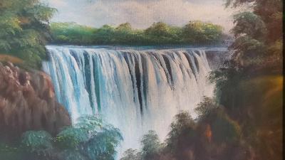 FRAMED PAINTING OF TROPICAL WATERFALL