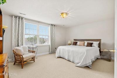 Sale Photo Thumbnail #8: One of two identical king beds, nice rattan chair.
