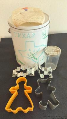 Tin full of cookie cutters plus vintage jar