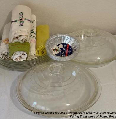 5 pyrex glass pie pans 2 wagnerware lids plus dish towels