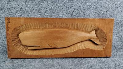 Carved wood whale plaque