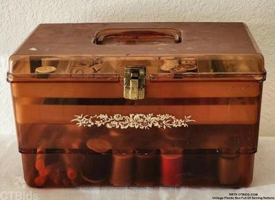 Vintage plastic box full of sewing notions 1