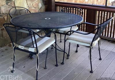 Black metal patio table and 4 chairs