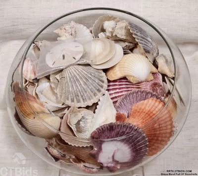 Glass bowl full of seashells