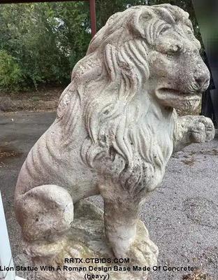 Lion statue with a roman design base made of concrete heavy)