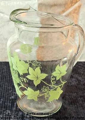 Vintage glass pitcher with green ivy etched pattern