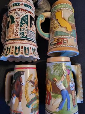 VINTAGE GERMAN BEER STEIN AND THREE BUDWEISER STEINS