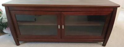WOOD TV STAND WITH GLASS DOORS AND FOUR SHELVES 