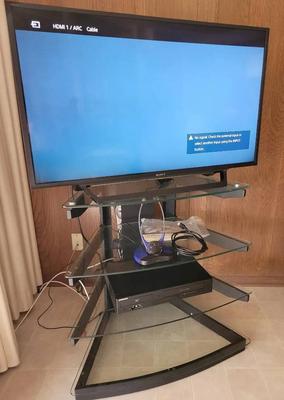 FLAT SCREEN TV, TV HEADSET, DVD/VHS PLAYER, AND STAND
