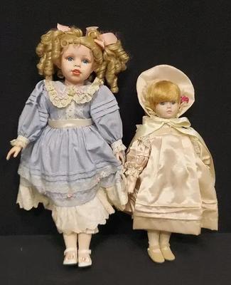 TWO VINTAGE PORCELAIN DOLLS