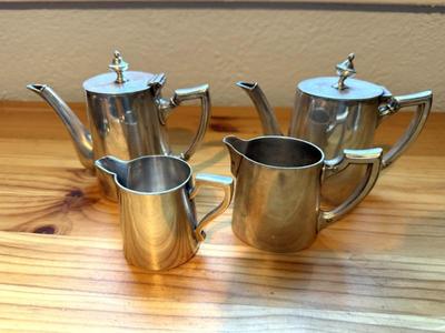 Grouping Of Silver Tone Teapots & Creamers 
