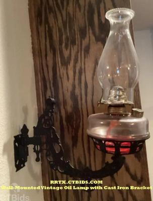 Wall mounted vintage oil lamp with cast iron bracket rrtx ctbids.com