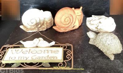 Two snails 1 frog 1 turtle 2 bird statues welcome sign rrtx ctbids.com