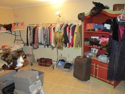 Sale Photo Thumbnail #46: Ladies' boutique with blouses, tops, dresses, pants, casual items, jeans, designer purses, belts, shoes, hats, and more. We also have an incredible selection of cosmetics and more—as well as sewing items and a Singer Sewing Machine.