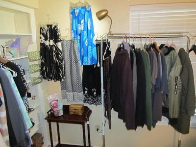 Sale Photo Thumbnail #56: Ladies' boutique with blouses, tops, dresses, pants, casual items, jeans, designer purses, belts, shoes, hats, and more. We also have an incredible selection of cosmetics and more—as well as sewing items and a Singer Sewing Machine.
