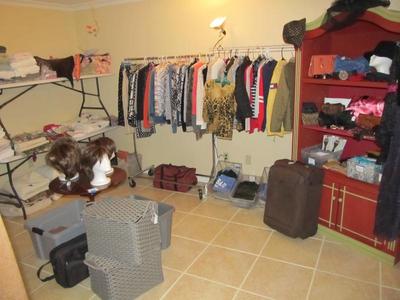 Sale Photo Thumbnail #53: Ladies' boutique with blouses, tops, dresses, pants, casual items, jeans, designer purses, belts, shoes, hats, and more. We also have an incredible selection of cosmetics and more—as well as sewing items and a Singer Sewing Machine.