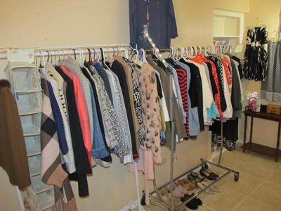 Sale Photo Thumbnail #55: Ladies' boutique with blouses, tops, dresses, pants, casual items, jeans, designer purses, belts, shoes, hats, and more. We also have an incredible selection of cosmetics and more—as well as sewing items and a Singer Sewing Machine.