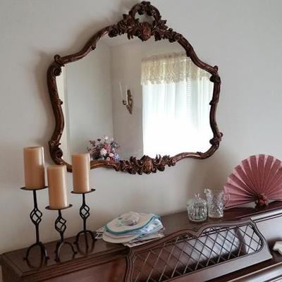 Ornate mirror, candlesticks, fan, piano
