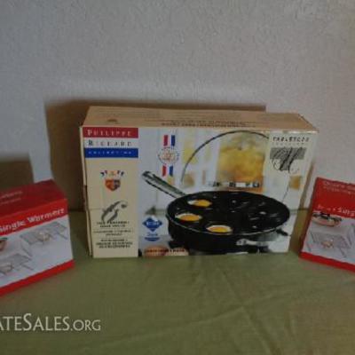 Egg poacher/deep fryer and set of table warmers

Philippe Richard Collection egg poacher/deep fryer still in box

Two sets of two table...