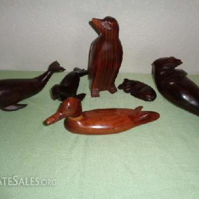 Mahogany carved animals

All are dark wood grain and solid wood: -1 whale -1 seal -1 penguin -1 cat -1 duck -1 otter