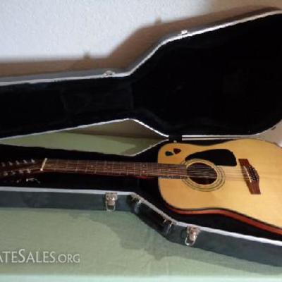 Fender guitar and black fender hard case

Good shape! Fender light and dark wood acoustic guitar

Black fender hard case