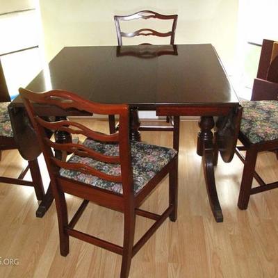 Duncan Phyfe Style Vintage Mahogany 3-Pedestal Drop Leaf Table with 3 additional Leaves and Custom Table Pads shown with 4 Mahogany Side...