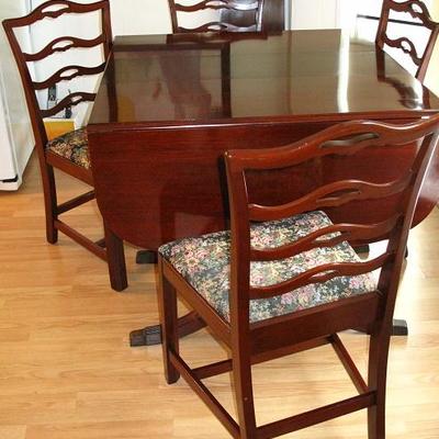 Duncan Phyfe Style Vintage Mahogany 3-Pedestal Drop Leaf Table with 3 additional Leaves and Custom Table Pads shown with 4 Mahogany Side...