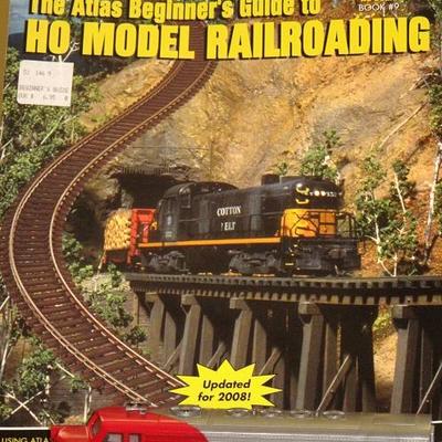 Atlas Model Railroad Co Book #9 and a Bachman HO Scale Diesel #307 Engine. Additional train cars and accessories not shown.