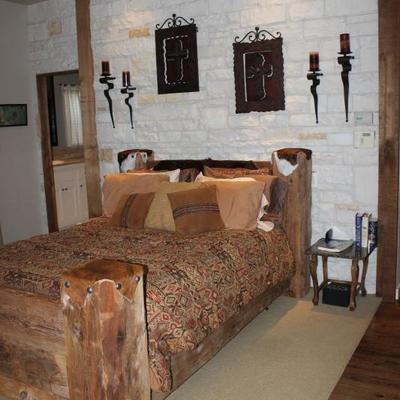 rustic king size bed, wall art, side table

