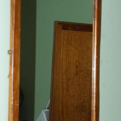 Wood trimmed antique mirror