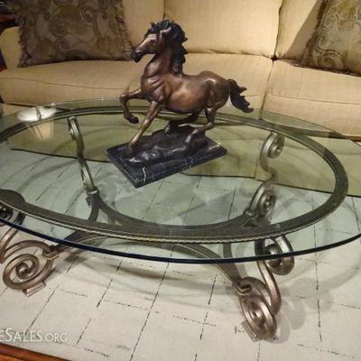 ORNATE METAL COFFEE TABLE WITH OVAL GLASS TOP
