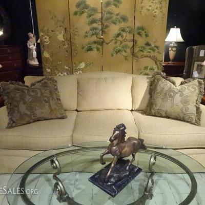 ORNATE OVAL METAL AND GLASS COFFEE TABLE