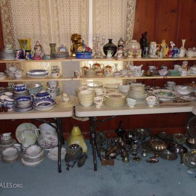 Many sets of fine china and misc items and a variety of silver plate and metal items