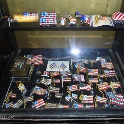 Large collection of American Flag Brooches and pins
