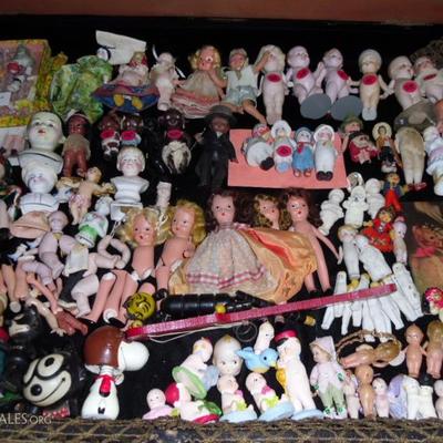 Many types of vintage miniature dolls, including kewpies