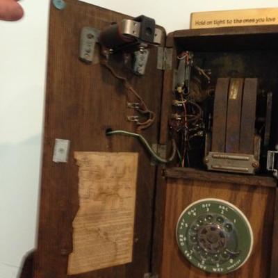 1950s rotary phone inside 1900s crank phone