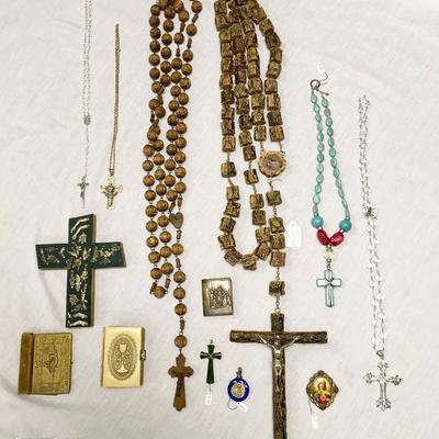 Assorted religious items, including two large prayer beads/wall rosaries